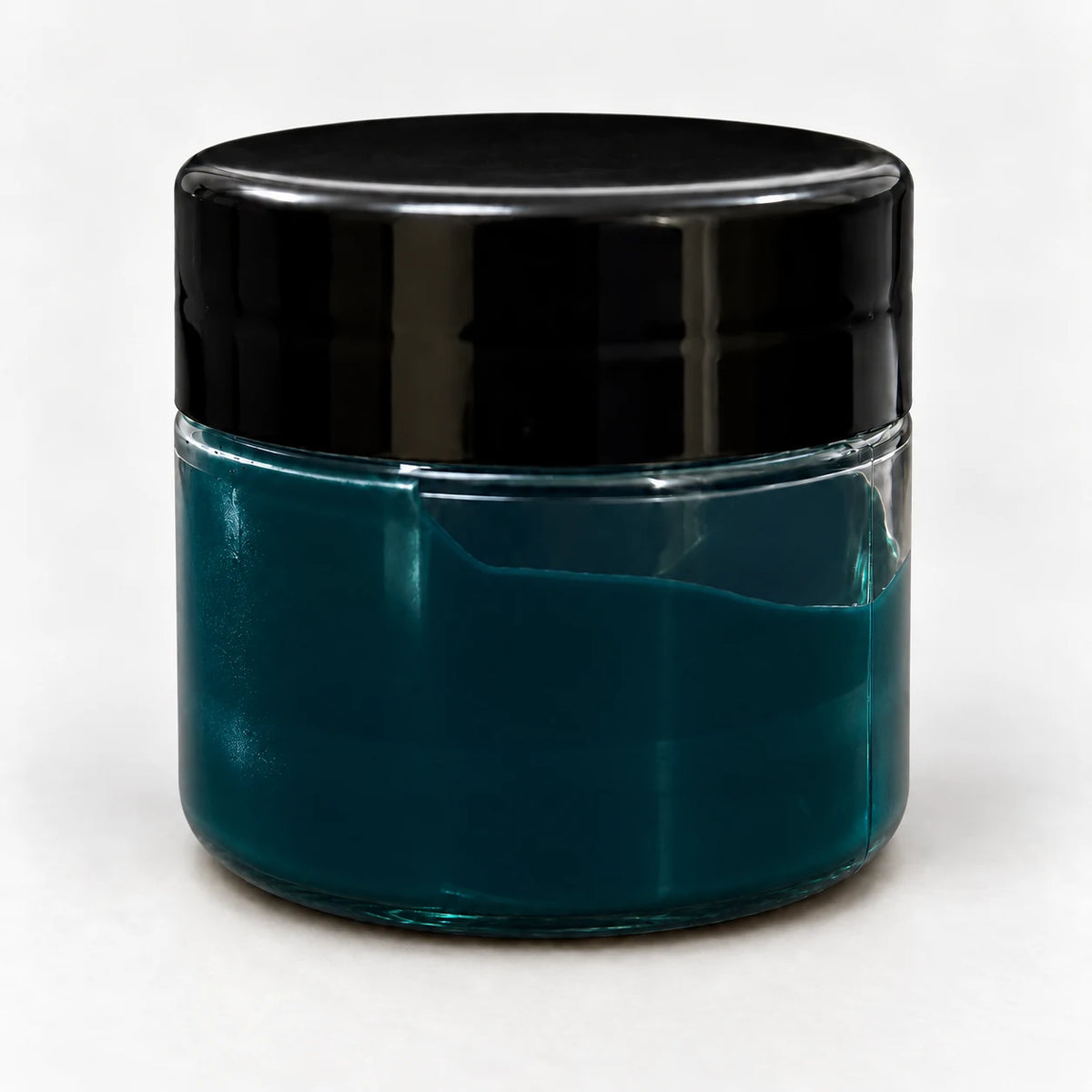 Green Transparent Pigment in a clear jar with a black lid