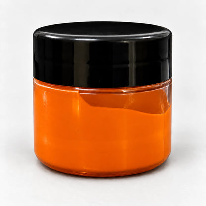 Orange Transparent Pigment in a clear jar with a black lid
