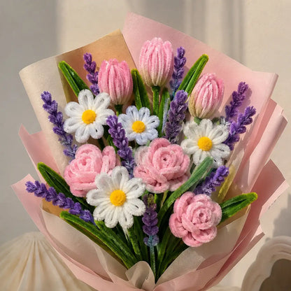 Close-up of handmade pink pipe cleaner roses and tulips with white daisies
