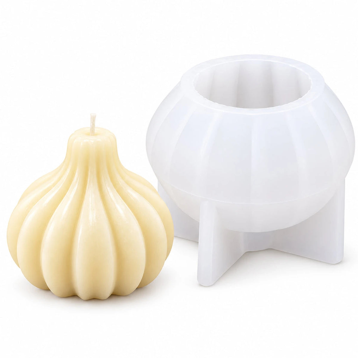 Modak-shaped silicone candle mould with an example ribbed candle